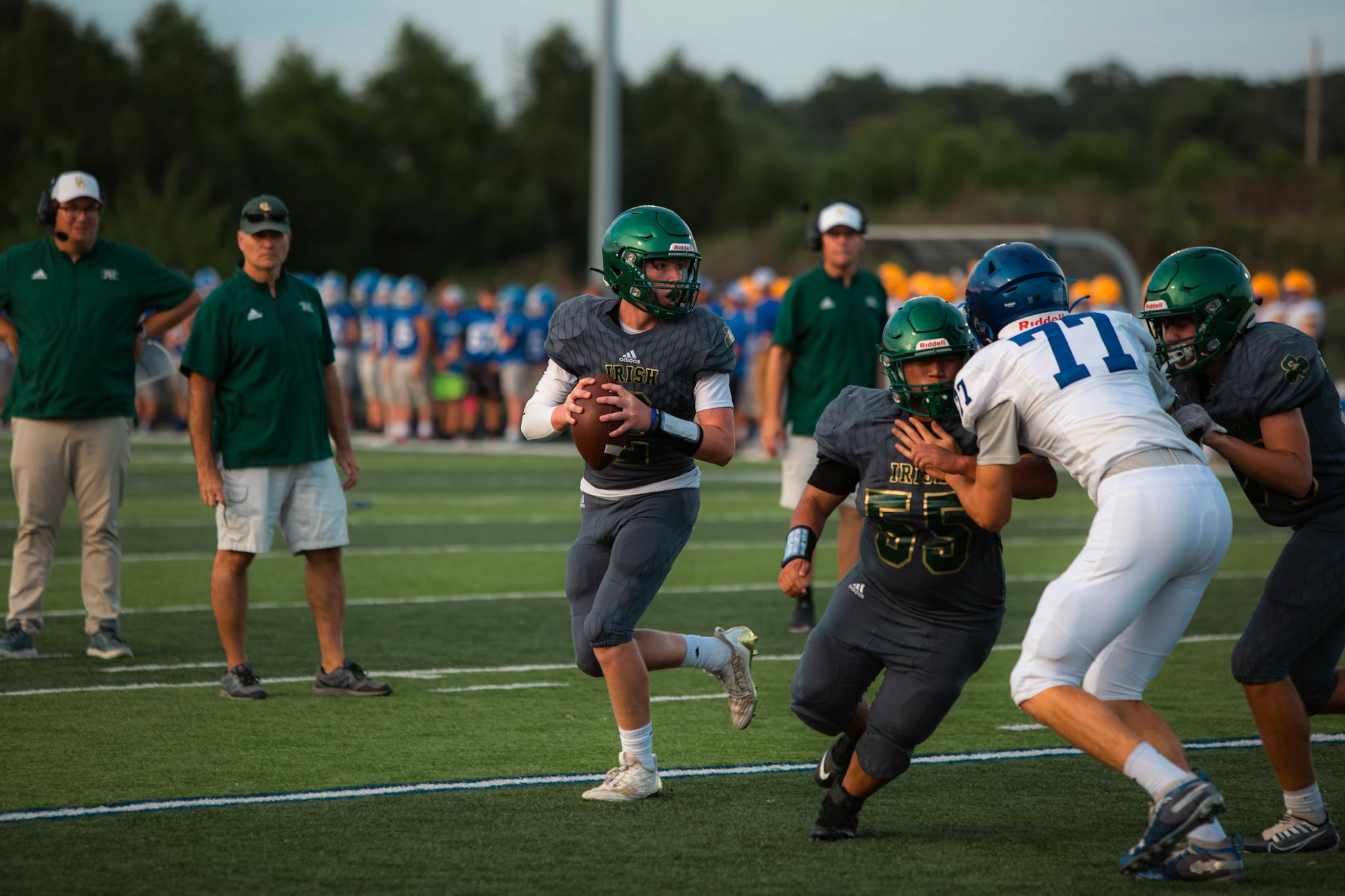Dynamic football action capture featuring athletes in competition at a football game.